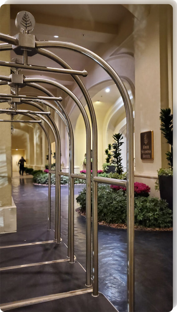 Forbes Industries Birdcage luggage carts at a luxury hotel